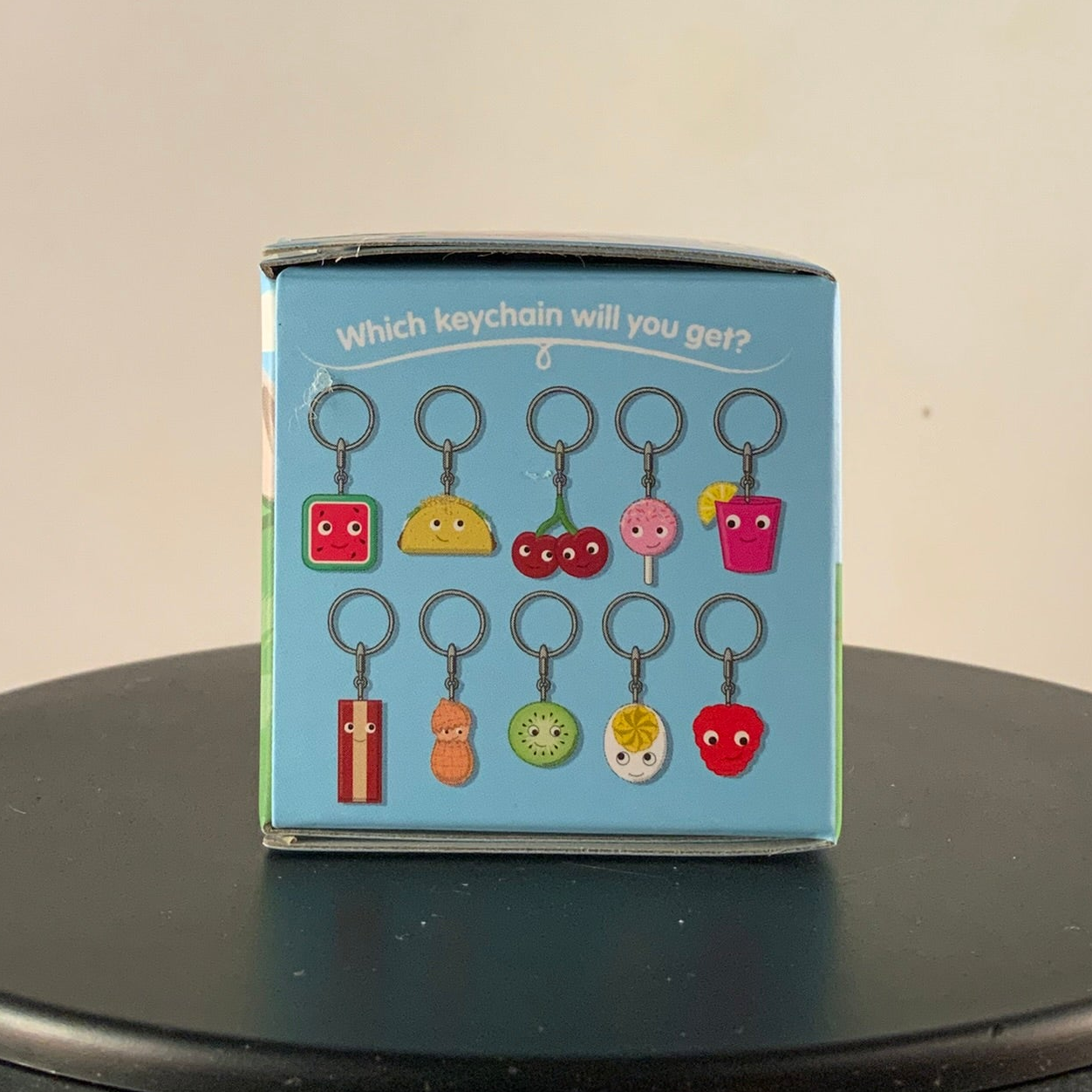 Yummy World Series 3 keychain designs shown on the blind box side